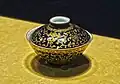 Gilded Qing dynasty porcelain, footed gaiwan.