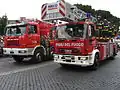 Italian Fire Service vehicles with an Astra crane on the left and a Magirus turntable ladder on the right, Army Parade in Rome, 2 June 2006.