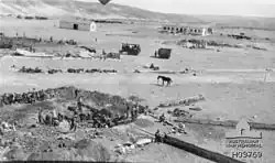 Water basin under construction, with horse tethered in center