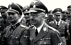 Photo of the 1941 SS tour of the Mauthausen concentration camp led by هاينريش هيملر؛ Otto Kumm (shown in front row, left), Wilhelm Bittrich and Paul Hausser took part in the tour