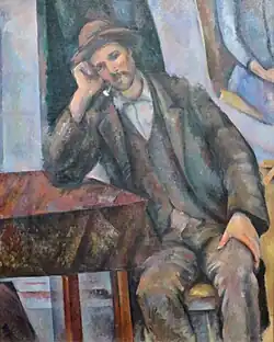 مدخن الغليون متكئًا على الطاولة 1895