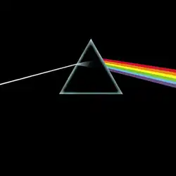 Original album artwork featuring an almost black cover with a triangular prism in the middle. A ray of white light enters the prism from the left and is refracted into colours as it comes out the right side.