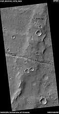 Trough cutting a wrinkle ridge, as seen by HiRISE under HiWish program  Location is the Coprates quadrangle, Mars.