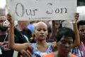 A person holding a sign in Ferguson