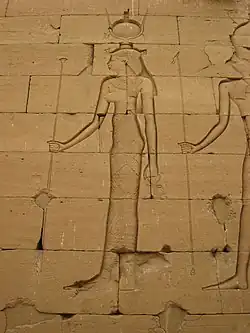 Relief of a woman in Egyptian clothing with an elaborate headdress