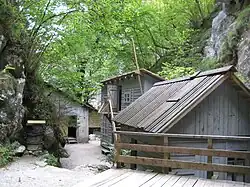 Wooden buildings in a narrow gorge
