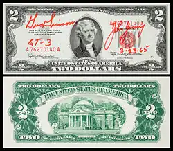 A 1953 $2-bill carried on the 1965 جيمني 3&nbsp;[الإنجليزية] mission and signed by Gus Grissom and John Young