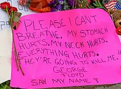 A memorial has been placed outside Cup Foods near 38th and Chicago Avenue South in Minneapolis, Minnesota, the site where a white Minneapolis police officer pressed his knee into the neck of George Floyd—an unarmed, handcuffed black man's neck, killing him.