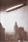 The أل زد 127 غراف زبلن flying over the building in 1934.