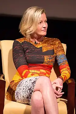 Mol seated onstage