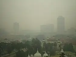 Smog over a city skyline.