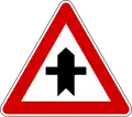 Italy and Latvia junction with a minor cross road sign.