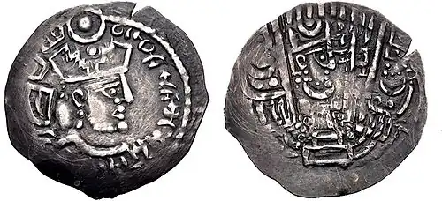 A silver drachm after Sasanian example of the Bukhar Khudahs, Sogdia, early 8th century. 30&nbsp;mm, 3.08 gr. The reverse shows the head of the king on the altar, the attendants almost unrecognizable