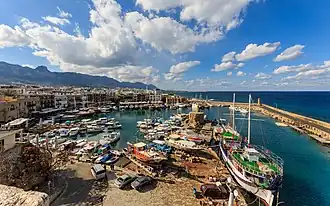View of Kyrenia Harbour with many boats docked, with buildings in the background