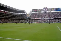 A photo of the "Casa Blanca"، LDU Quito's stadium، showing their biggest firm "La Muerte Blanca".