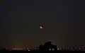 From Longjing District، تاي شانغ at moonrise, 9:45 UTC
