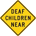 Deaf children near sign, California.