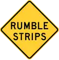 New York State rumble strips ahead sign.