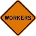 U.S. and Canada Workers on the road sign.