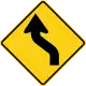 U.S. and Canada sharp reverse curves ahead sign.