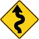 U.S. and Canada winding road ahead sign. (opposite direction)