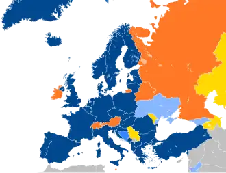 A map of Europe with countries in blue, cyan, orange, and yellow based on their NATO affiliation.