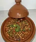 Traditional Algerian tajine mtewem served in a tajine pot in Algiers, Algeria.