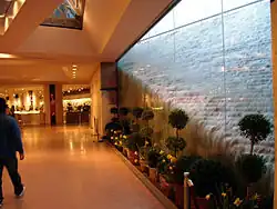 Gift shop and waterfall cascade in the concourse