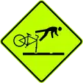New Zealand cyclists watch for track-ruts.