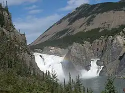 Waterfalls on a river, surrounded by granite peaks