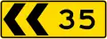 New Zealand curve chevrons with advisory speed limit.