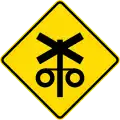 New Zealand railroad crossing with signals ahead.