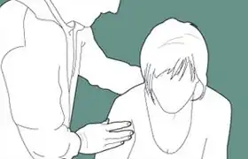 تصوير لشخص يعاني من نوبة هلع، يتم طمأنته من قبل شخص آخر.