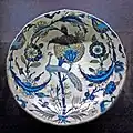 Dish covered with rosettes, saz leaves and a peacock, c. 1540–1555