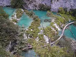 Turqois colored lakes among white rocks.