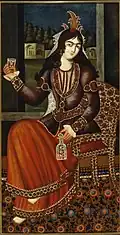 Woman holding a bottle and glass.
