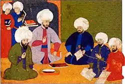 The consultation for the programme of the Şahname-ı Selim Han, with the scholars Şemseddin Ahmet Karabaği, Seyyid Lokman, the writer Ilyas Katib and the painters Nakkaş Osman and Ali, 1571–81 (folio 9r)