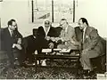 الشيخ / عبد الله بن تركي السبيعي رئيس اللجنة الشعبية القطرية لدعم ثورة الجزائر وهو يسلم تبرعات شعب وحكومة قطر لممثل جبهة التحرير الجزائرية لدى جامعة الدول العربية المجاهد / أحمد توفيق المدني