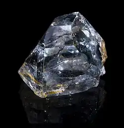 A light blue chunk of topaz cutting rough.