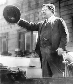 A photograph of Theodore Roosevelt speaking publicly shortly before the assassination attempt against him.
