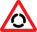 U.K. large roundabout ahead sign.