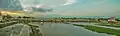 river with water flowing amidst weeds